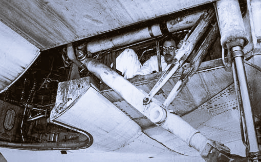 A picture showcasing how a stowaway encapsulates them in the Wheel well of an aircraft